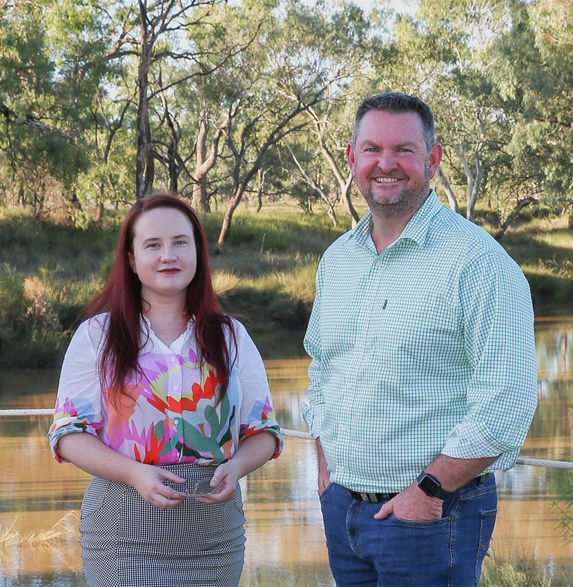 Shona and Charles from Charles legal group standing in front of local waterway